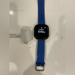 Gizmo watch with blue band and charger